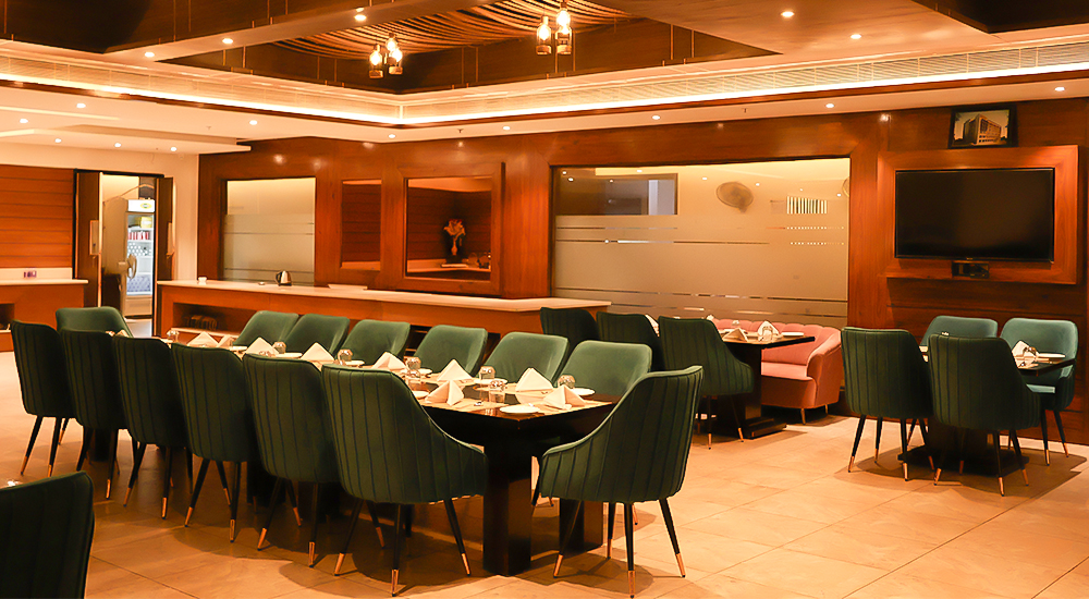 Elegant multi-cuisine restaurant with stylish seating and fine dining experience in Dehradun hotel